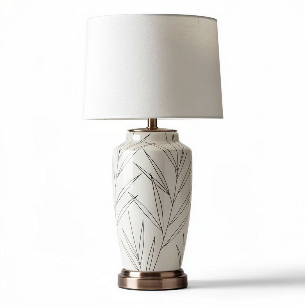 Lampada da tavolo in ceramica bianca con motivo fogliare altezza 40cm diametro 20cm base in metallo bronzato